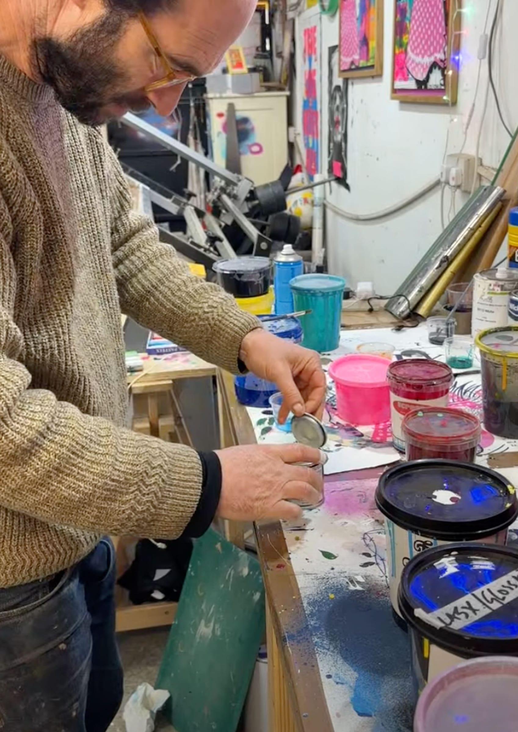 Pouring ink into a small test pot