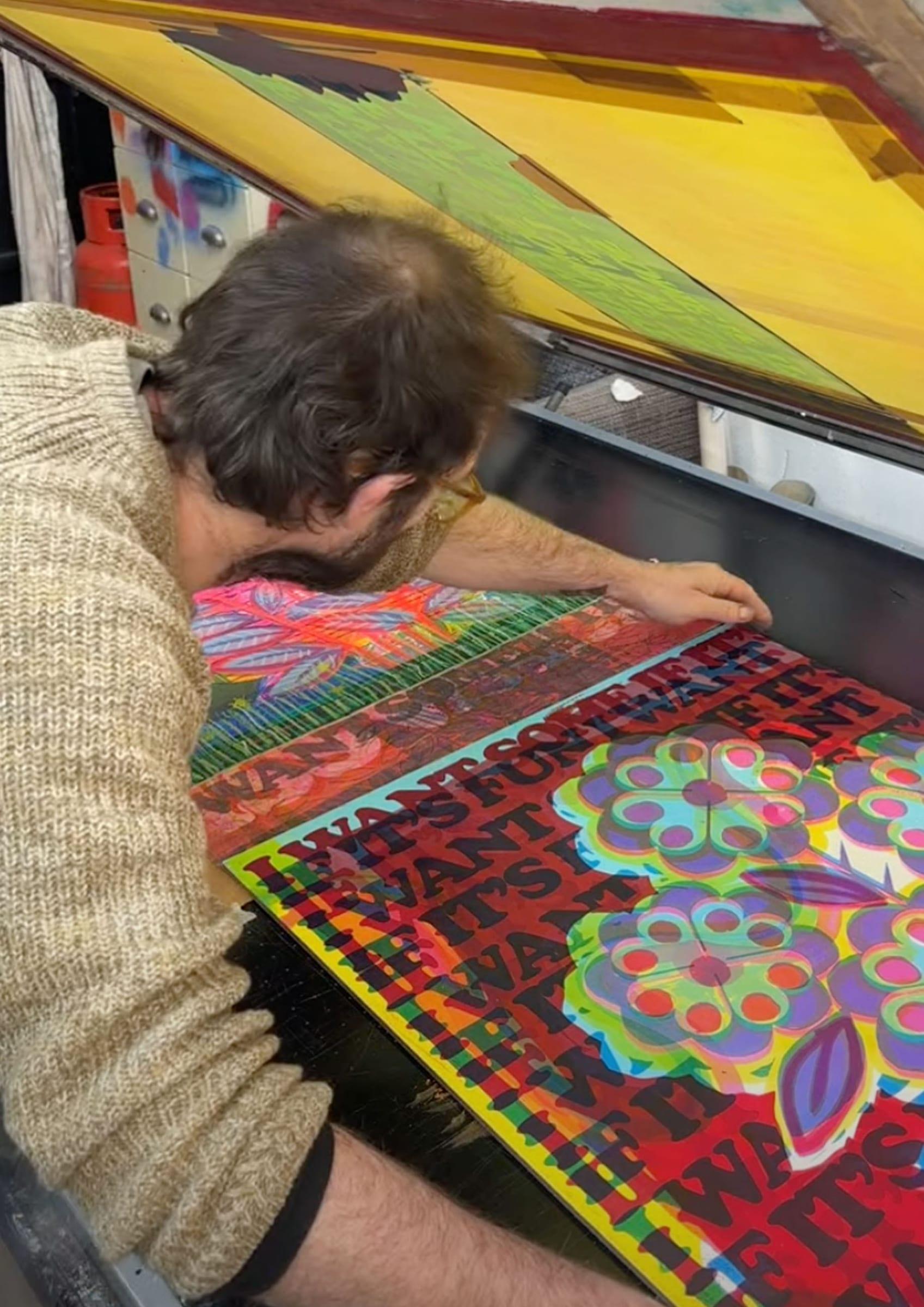 Checking a fresh print against the screen for registration