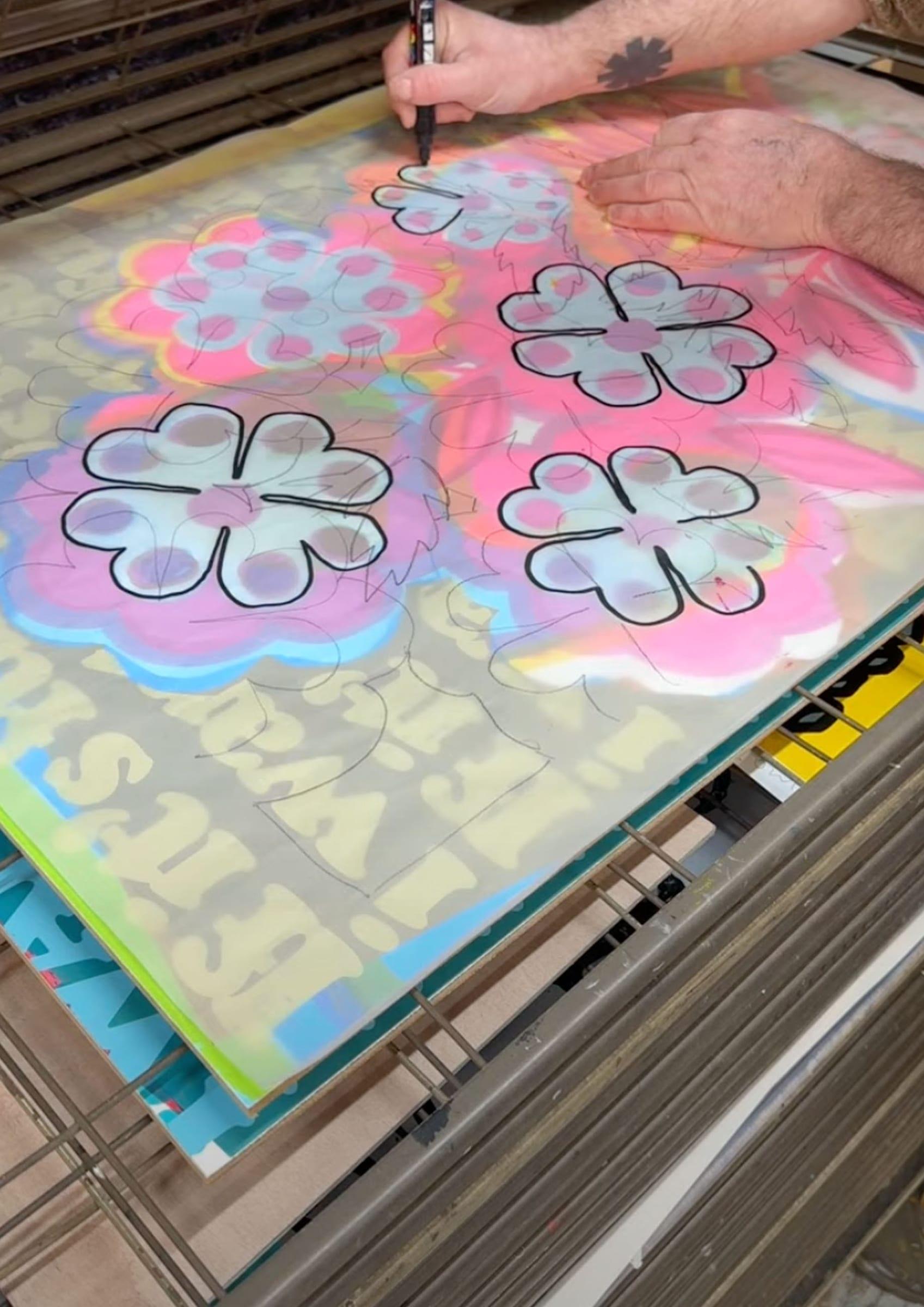 Drawing flower outlines onto the screen positive with a marker