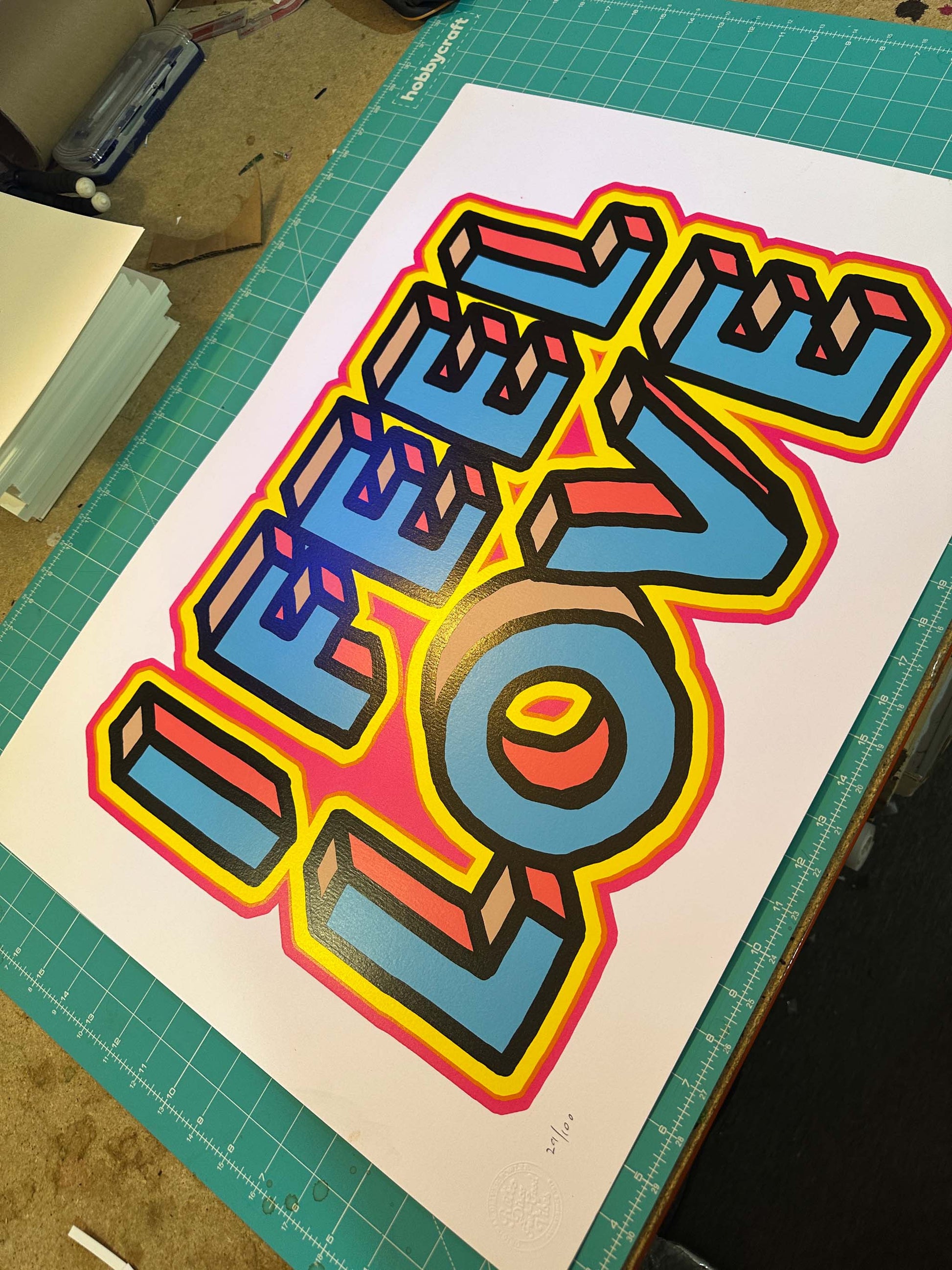 I Feel Love hand-pulled screenprint by Oli Fowler — bold 3D lettering in neon blues, pink and yellow on white paper