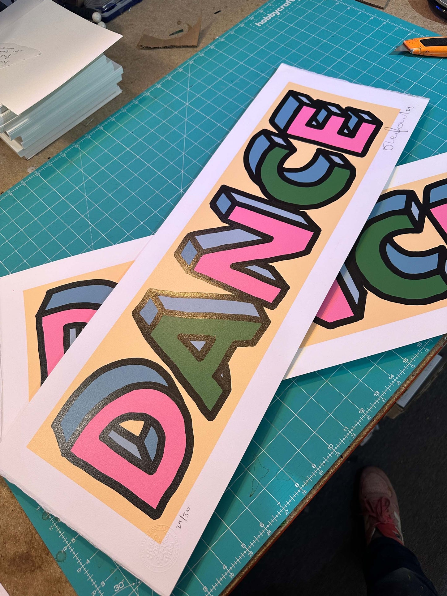 Dance misprint hand-pulled screenprint by Oli Fowler — bold 3D lettering in pink, blue and green on peach