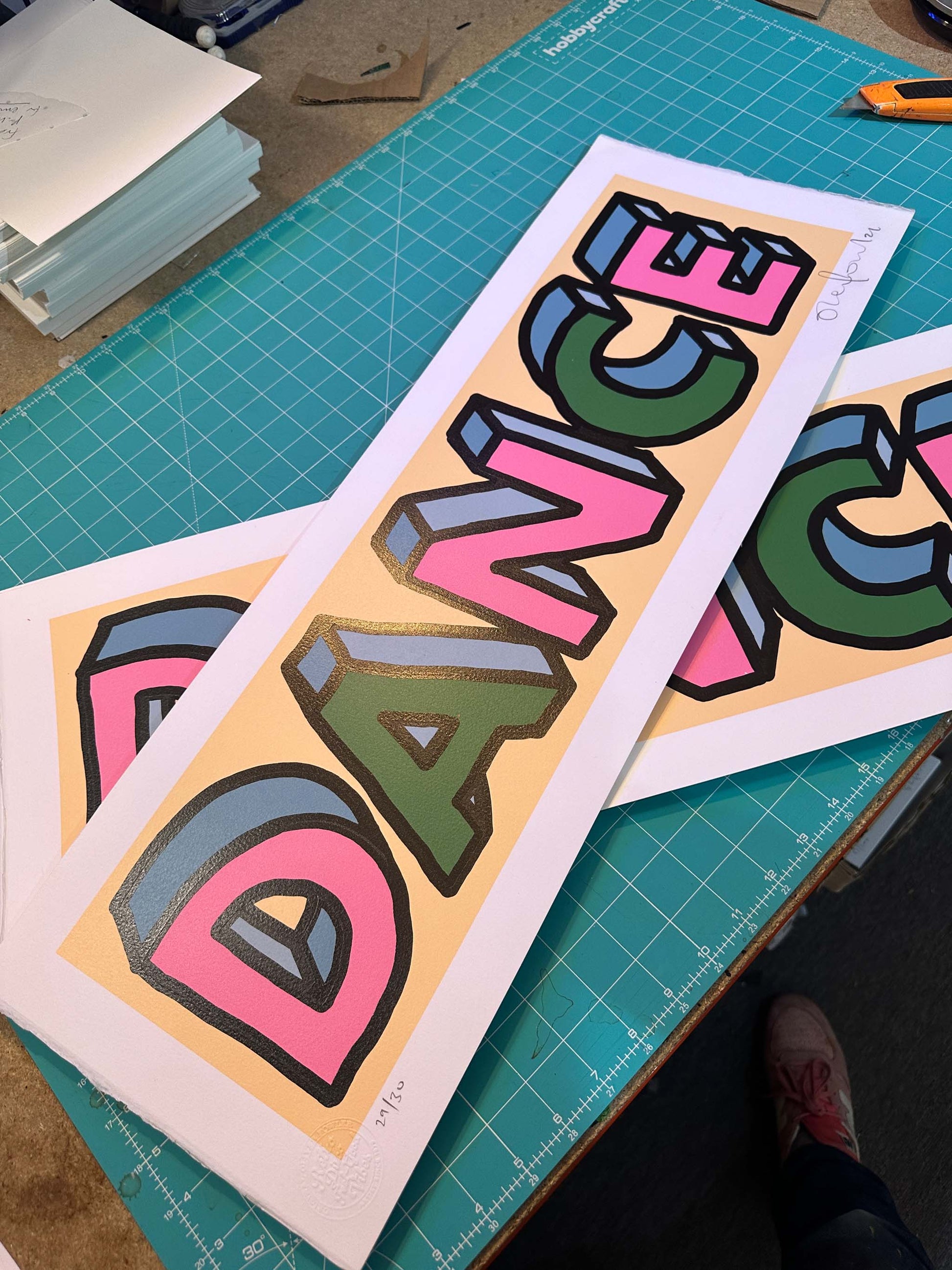 Dance misprint hand-pulled screenprint by Oli Fowler — bold 3D lettering in pink, blue and green on peach